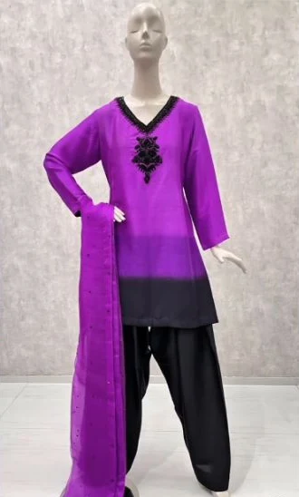 Purple outfit on a mannequin with contrasting black handwork