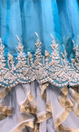 Teal bridal fabric with intricate embellished floral borders