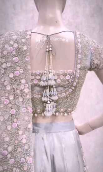 Custom sari blouse with a shaped back and pearl tassels
